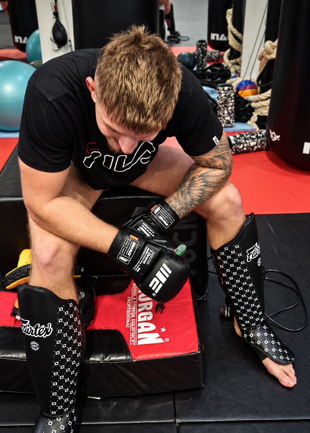 Athlete gassed out mid-session in a fight gym